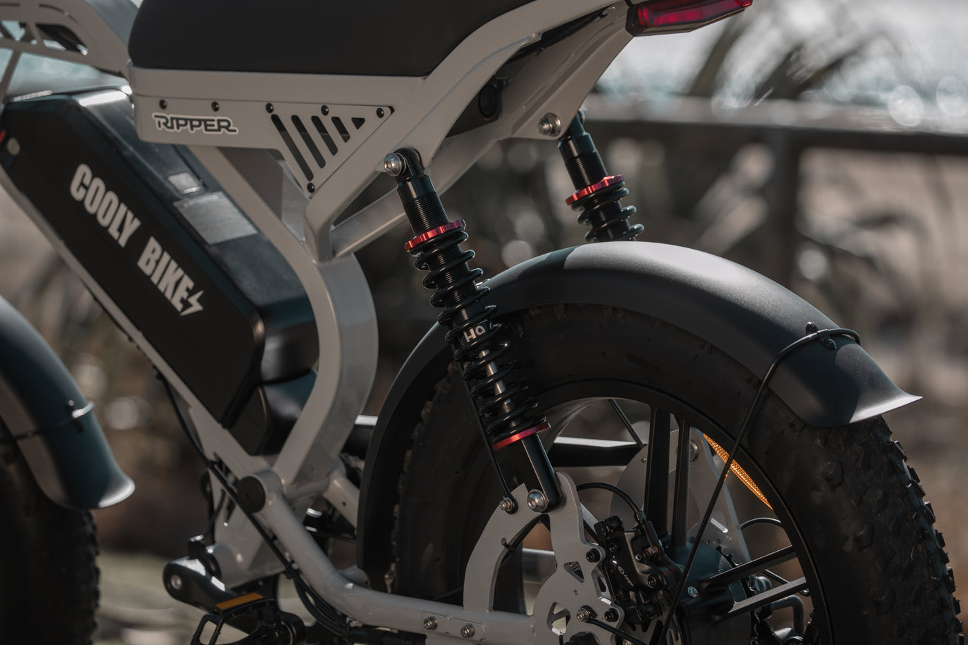 Close-up of a electric bike with visible Cooly Bikes Branding on a blurred background