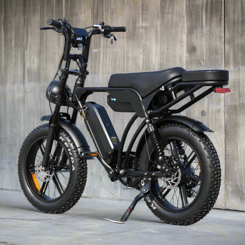 Black electric bike parked on a concrete surface