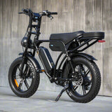 Black electric bike parked on a concrete surface